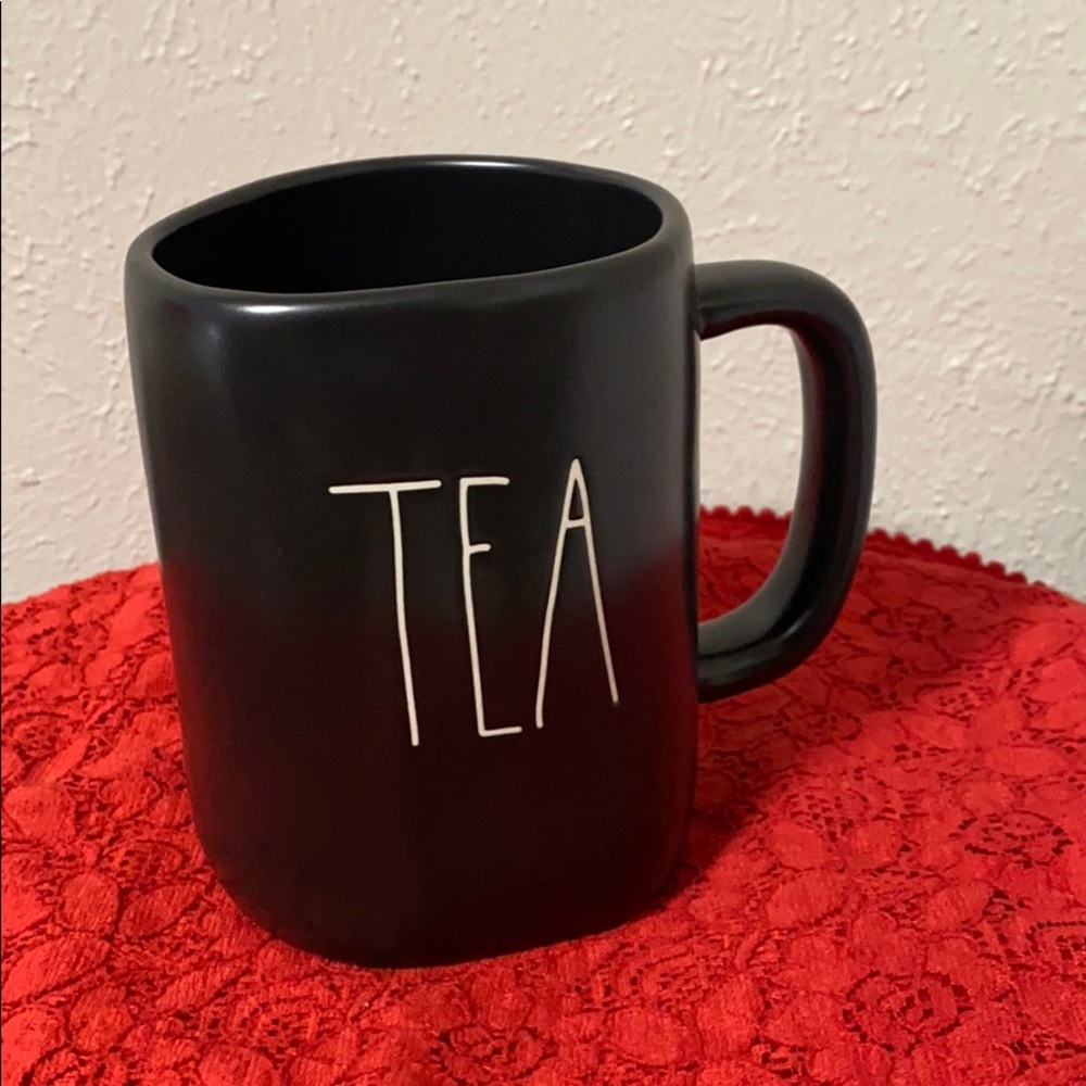 Black Rae Dunn mug with “Tea” text